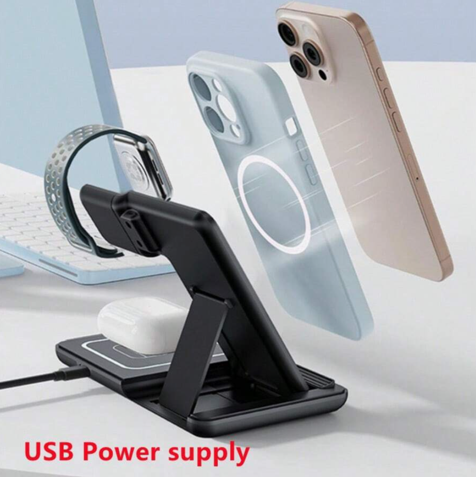 Black phone stand with USB power supply on a desk with smartphone and keyboard in the background.